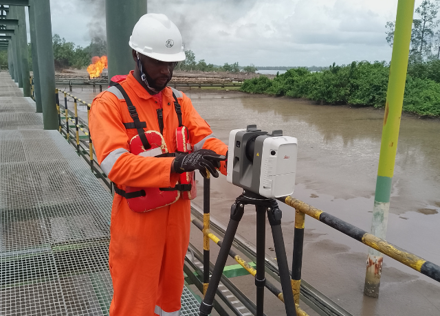 Alchris Energy Services Engineer scanning a facility with a 3D Laser Scanner